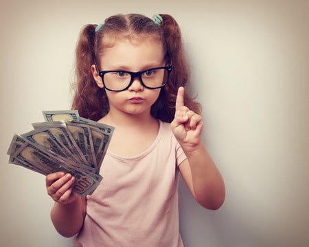 little girl holding money