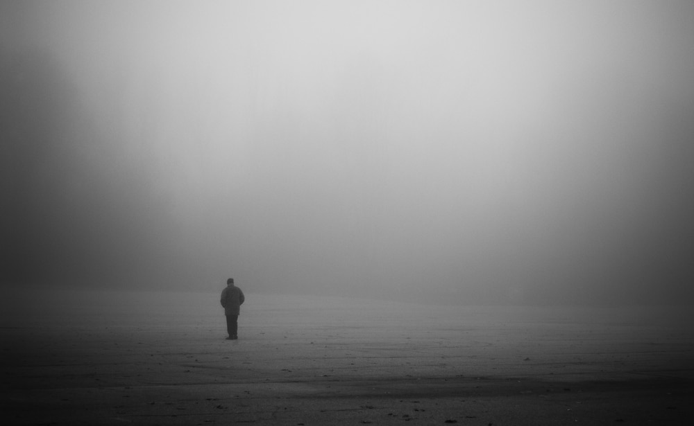 man alone in fog