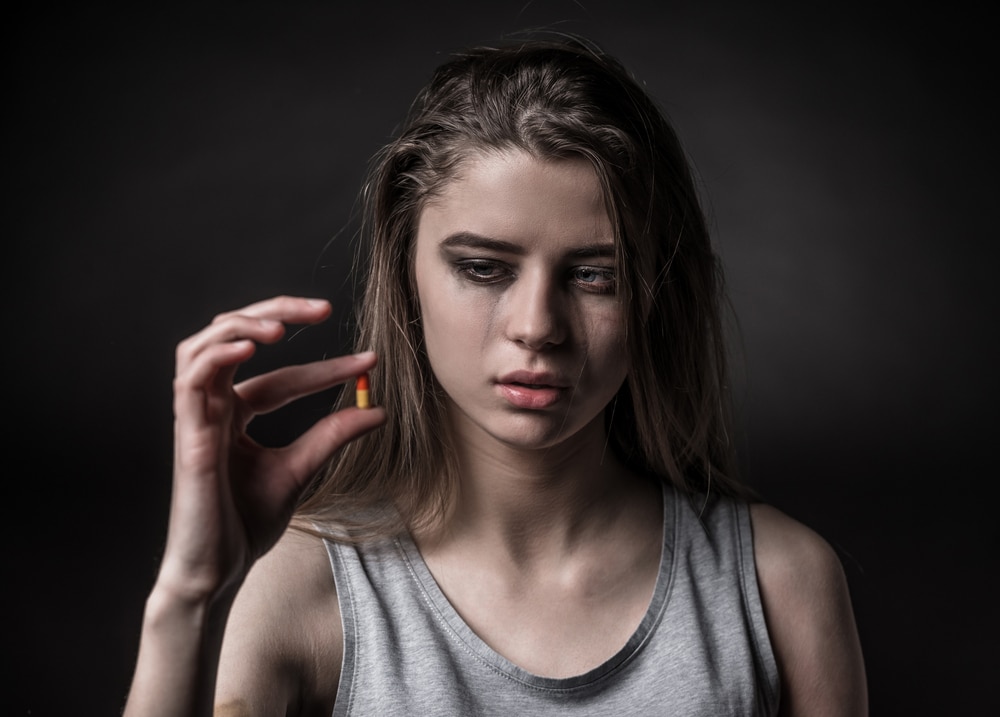 woman depressed take pills