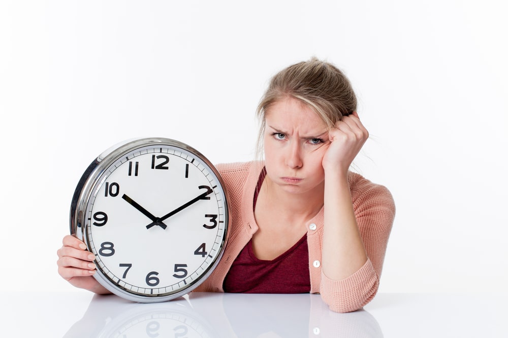 woman tired with clock