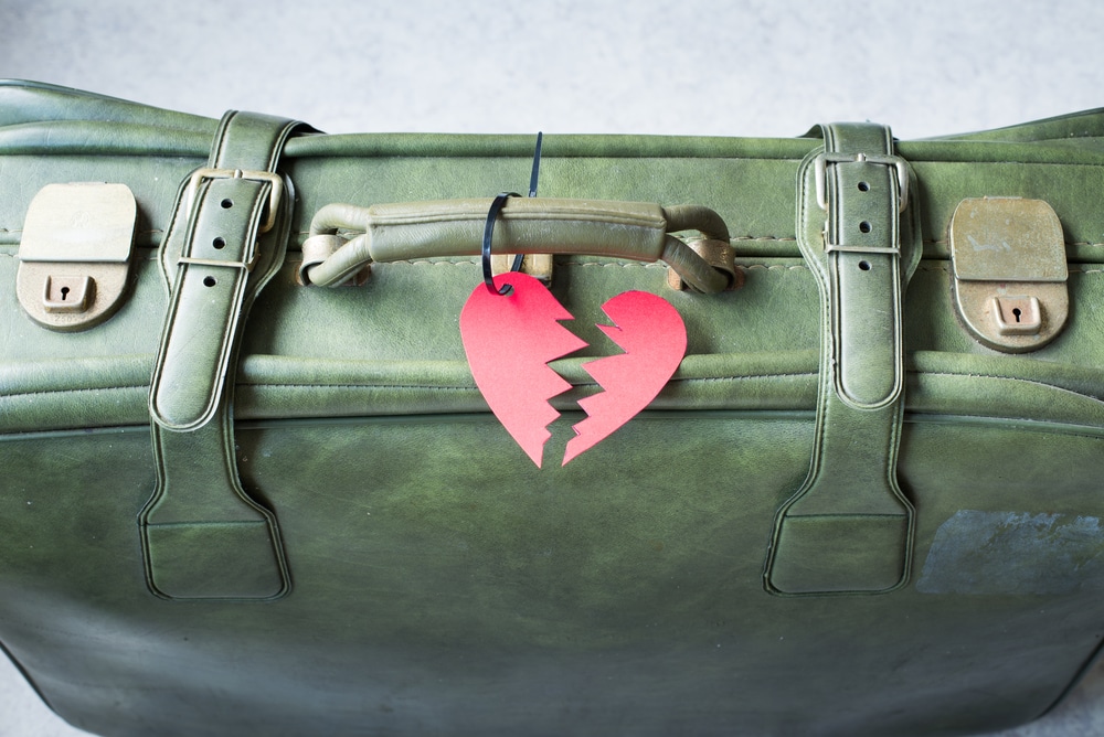 suitcase broken heart breakup concept