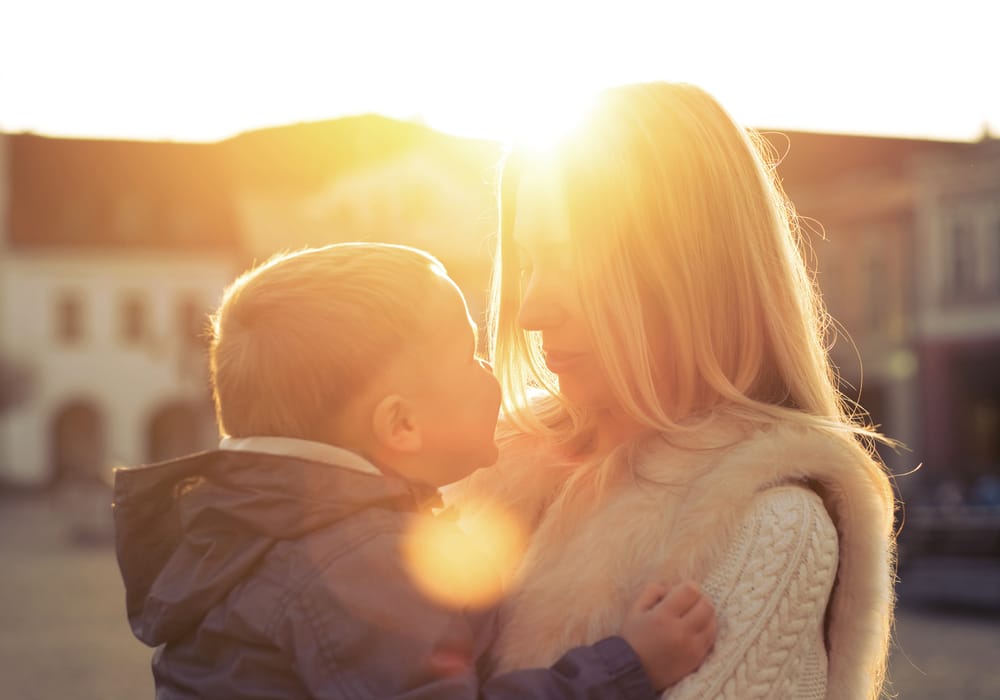boy and mother in the sun