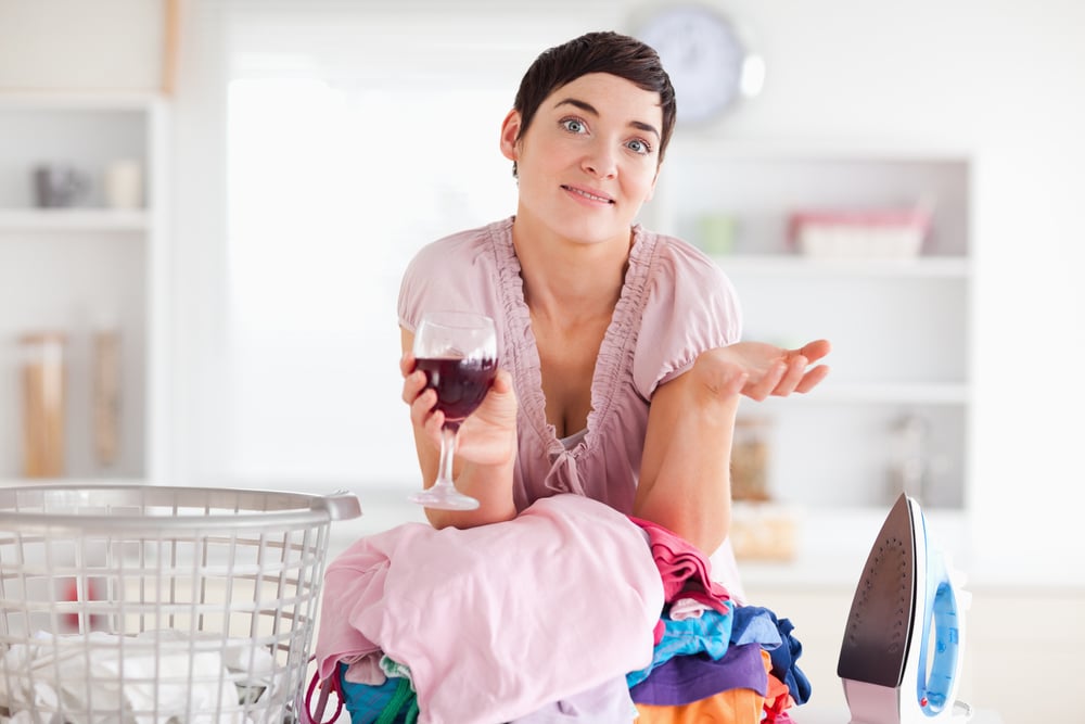 woman drink wine with laundry