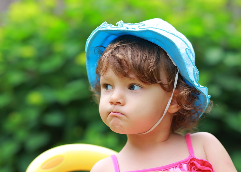 little girl unhappy summer