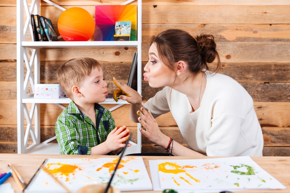 kid and mother painting