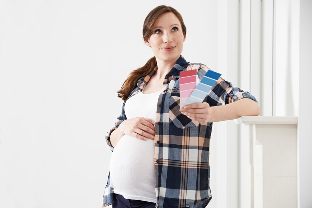 pregnant woman with blue pink paint