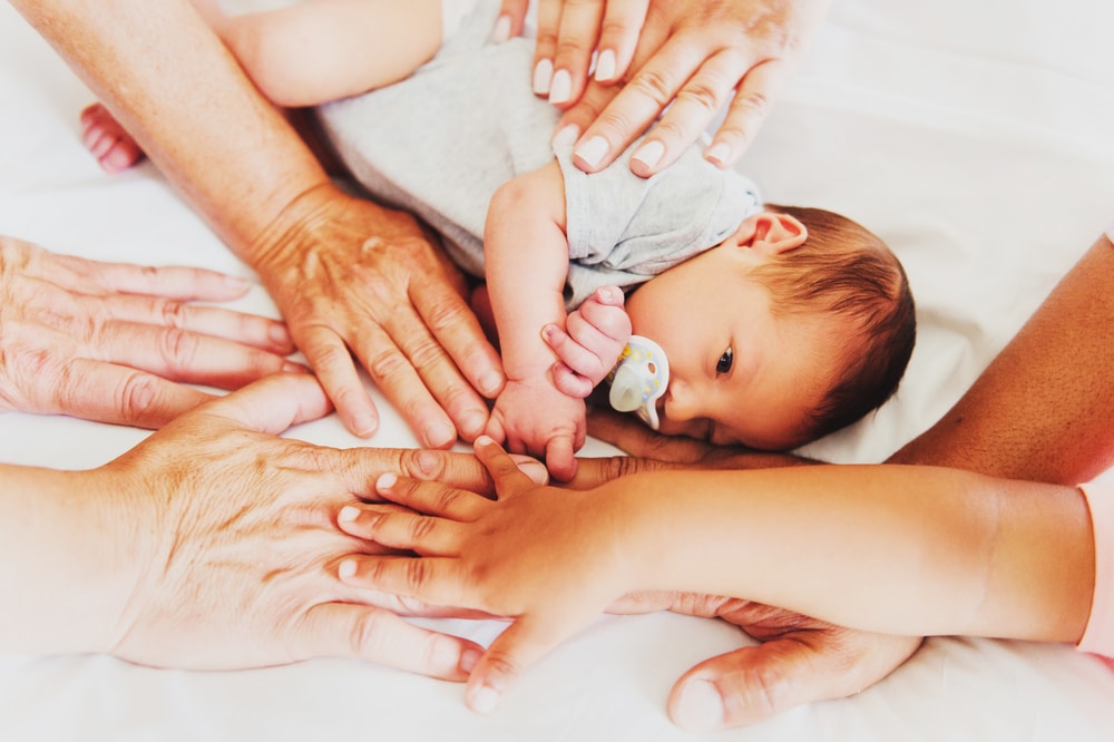 newborn with many hands