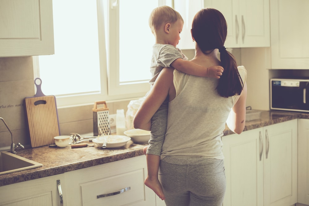 woman with toddler in kitchen
