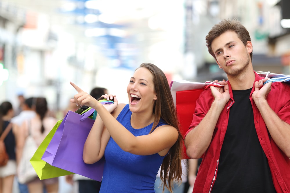 couple shopping unhappy man