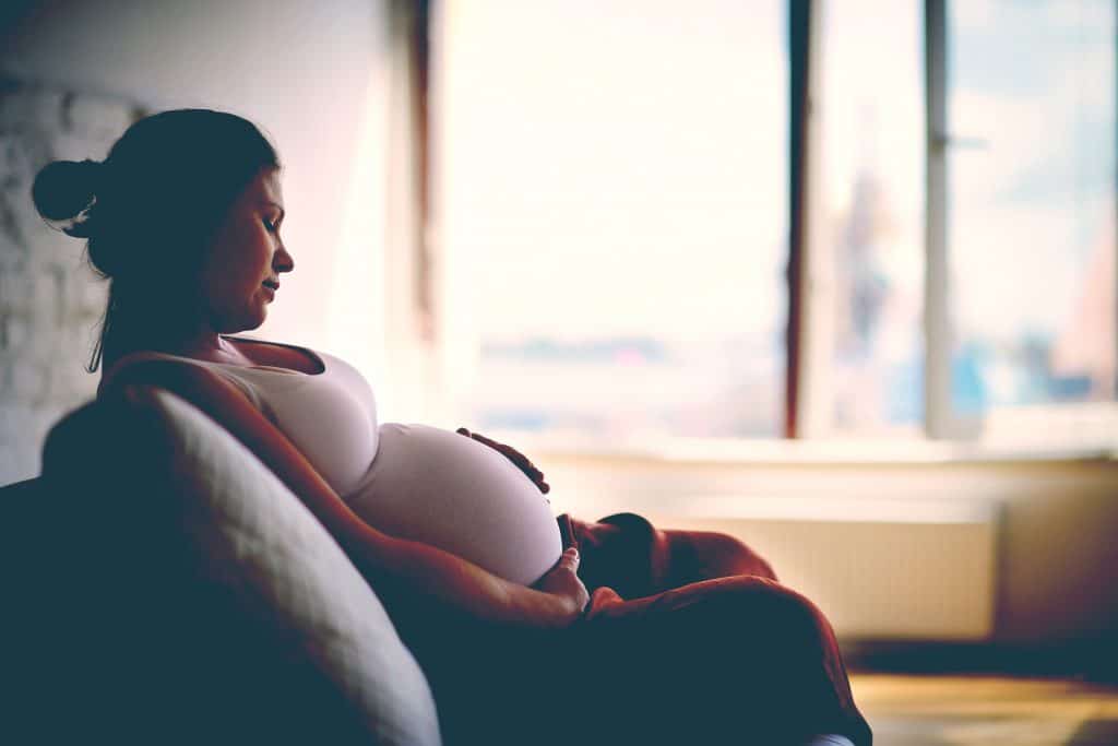 pregnant woman on couch