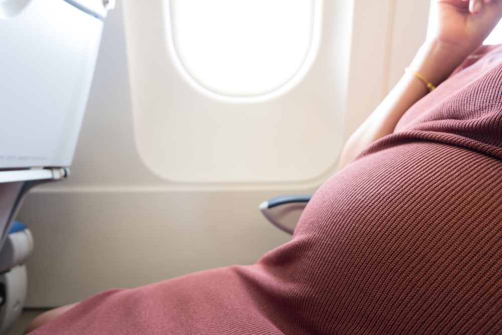 pregnant woman in a plane