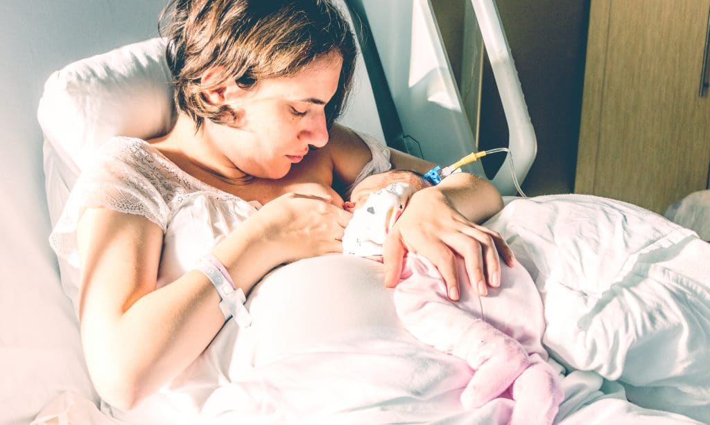 mother breastfeed newborn