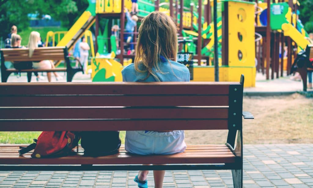 woman sit at playground